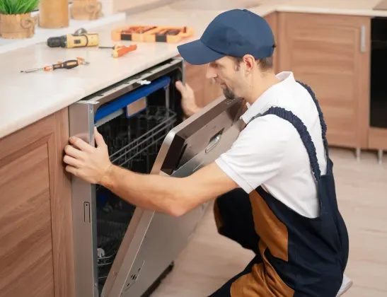 man-repairing-broken-dishwasher